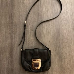 Michael Kors cross body purse with gold buckle